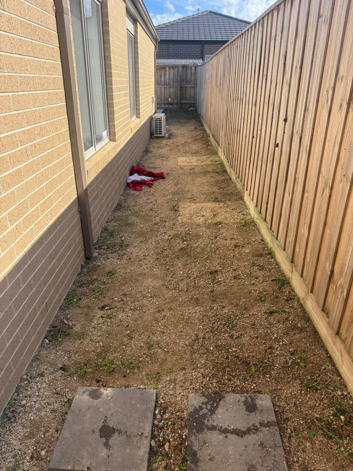 Same residential lawn after mowing, with an even cut, sharp edges and a clean finish