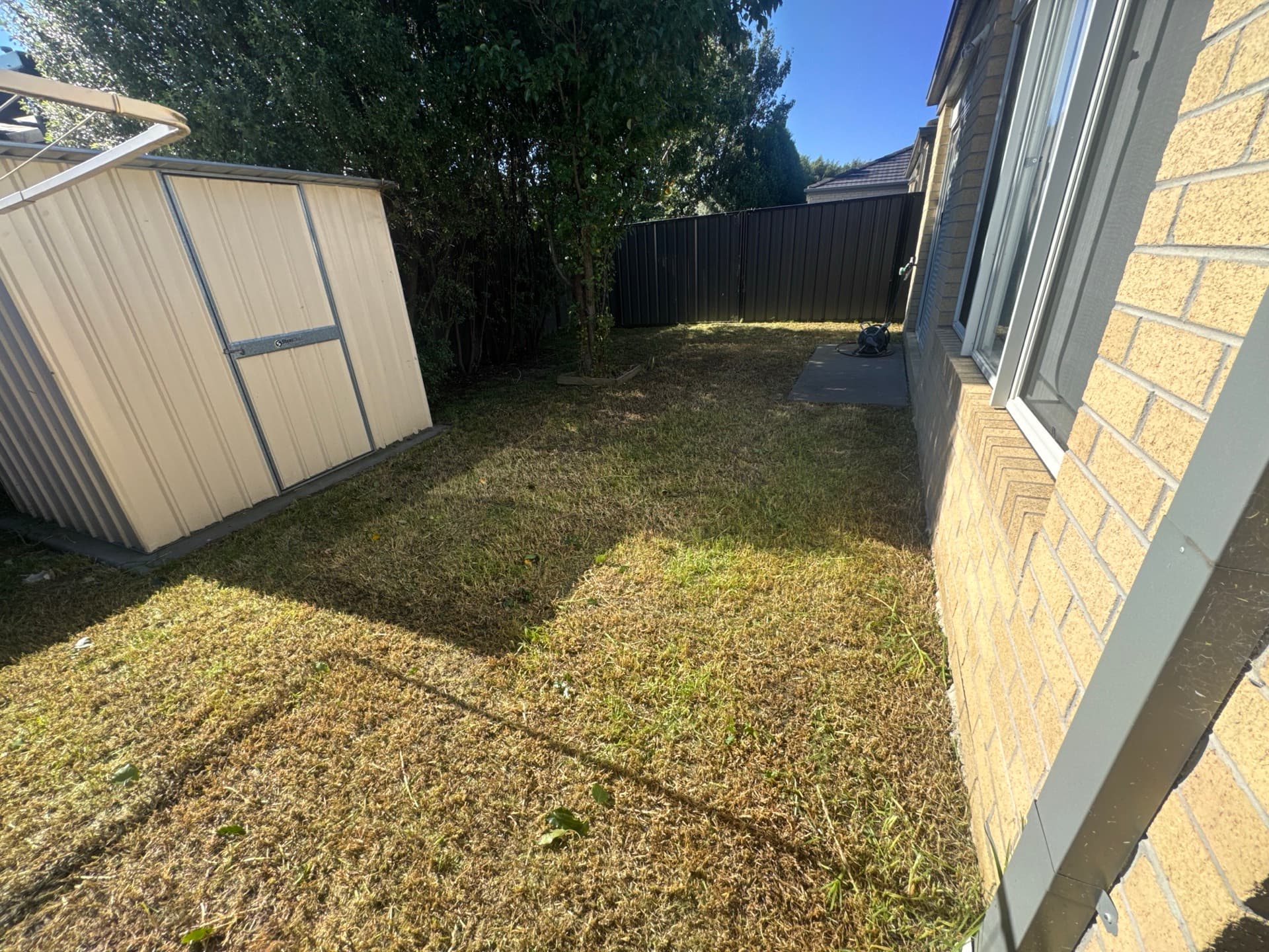 Same lawn freshly mowed with crisp edging by Laser Cut Mowing