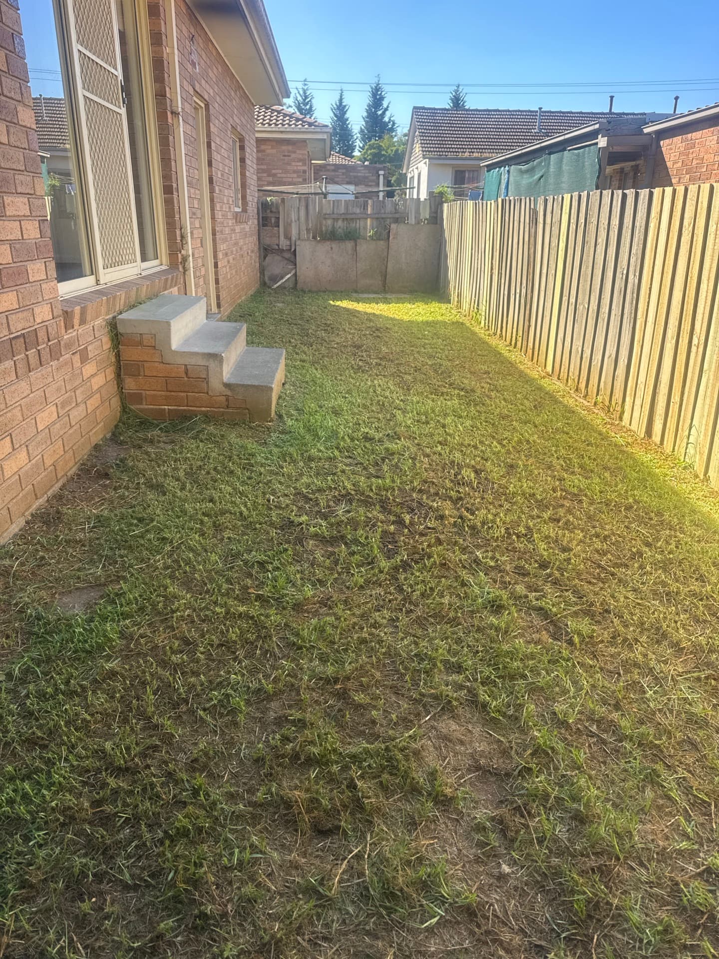 Tidy residential yard after mowing, edging and a clean-up by Laser Cut Mowing